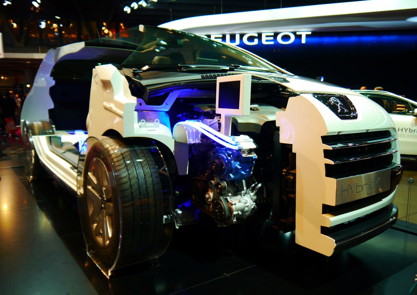 Cutaway view of front chassis and hybrid engine with integrated display screen