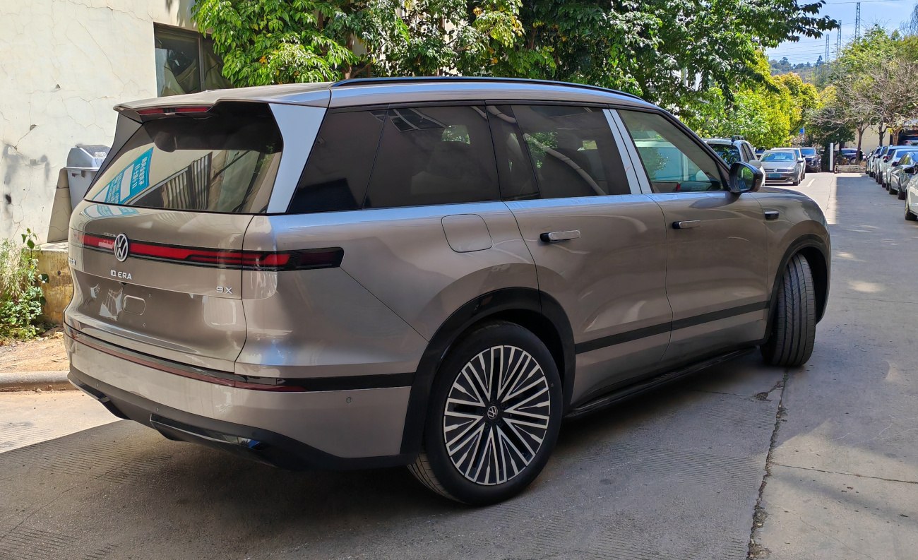 Electric SUV rear-side view with sleek lines and unique tail lights