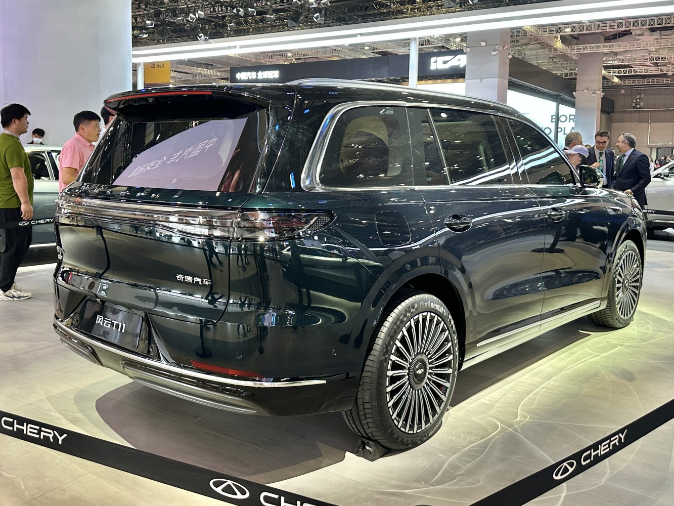 Luxury SUV rear with distinctive taillights and elaborate wheel design