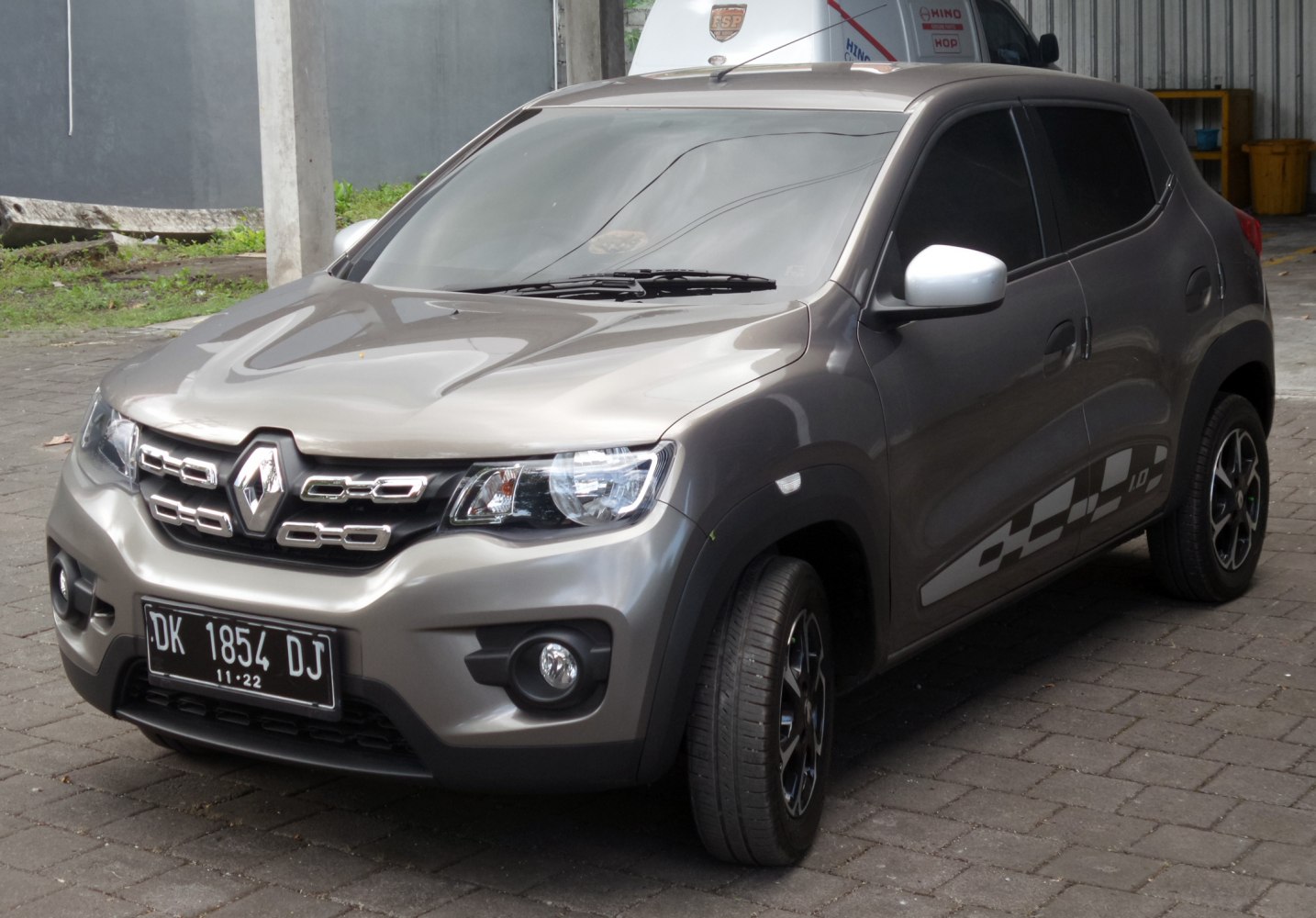 Front side view with distinctive grille and compact SUV design
