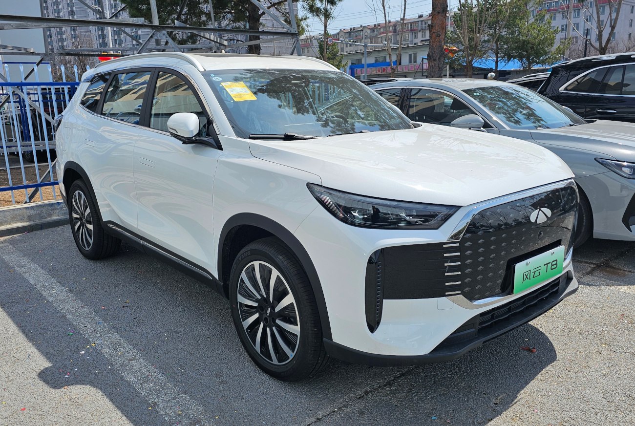 White electric SUV with LED headlights and aerodynamic body design