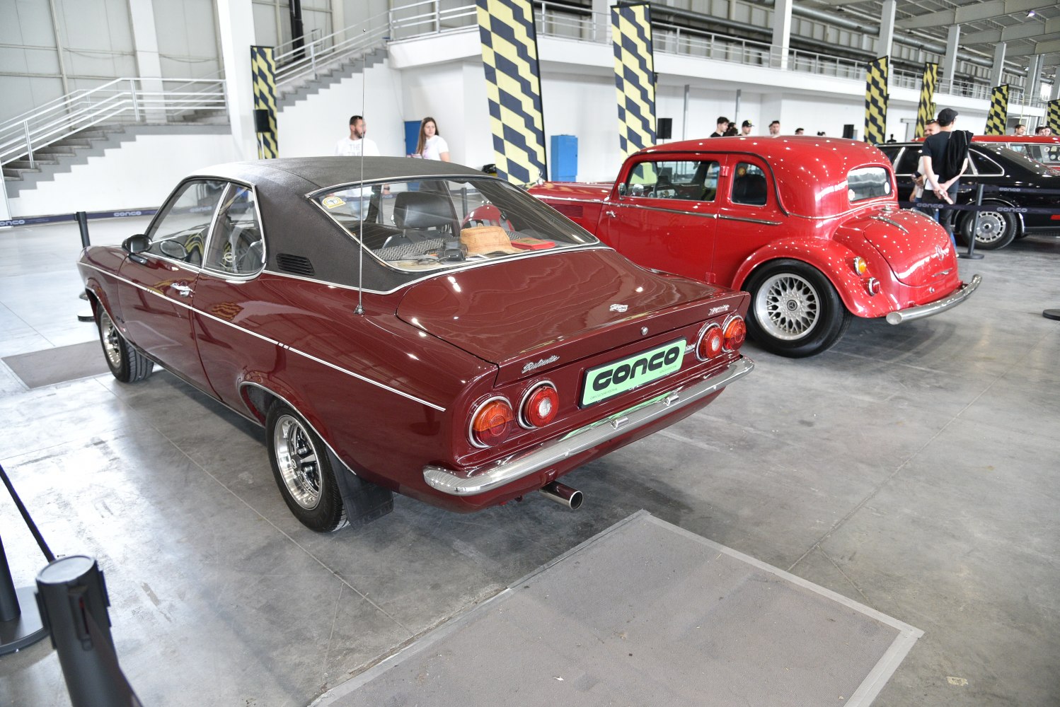 Rear view of a vintage coupe with vinyl roof and classic taillights