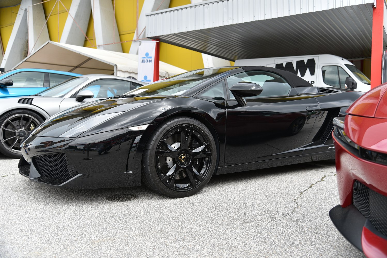 Black convertible with sporty design and black alloy wheels