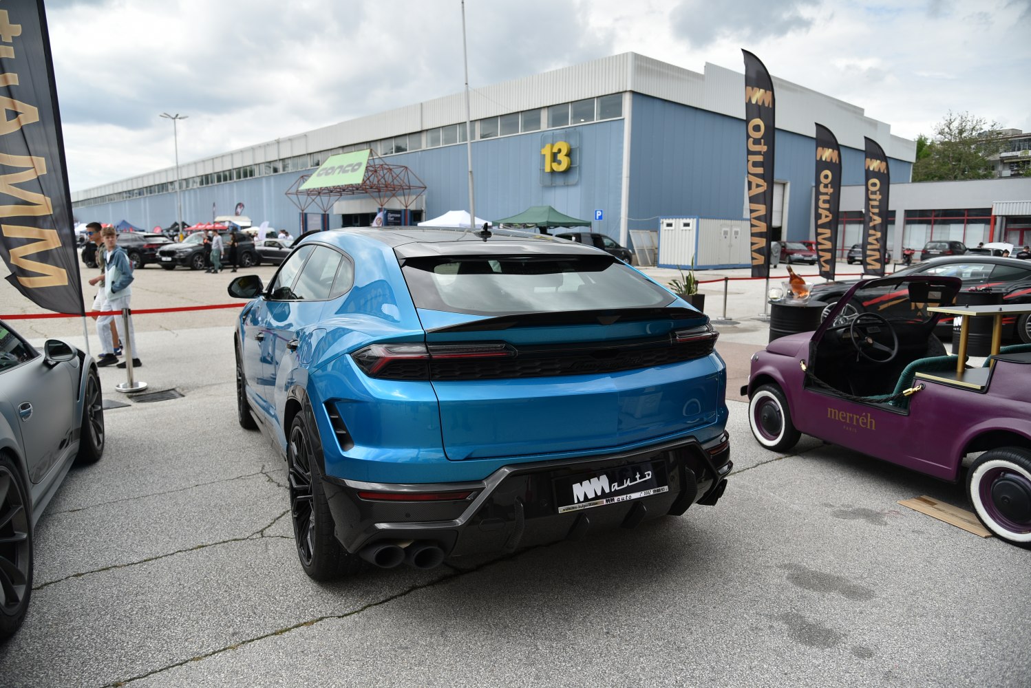 Rear view of blue SUV with quad exhaust and LED taillights