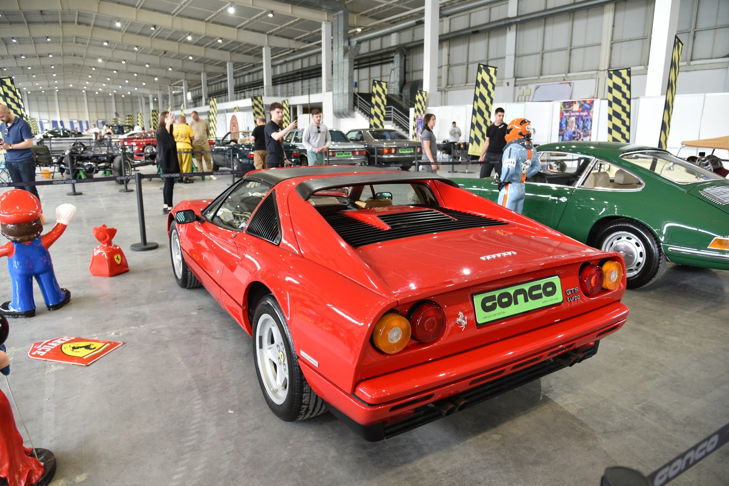 Red sports coupe with rear louvered window and twin round taillights