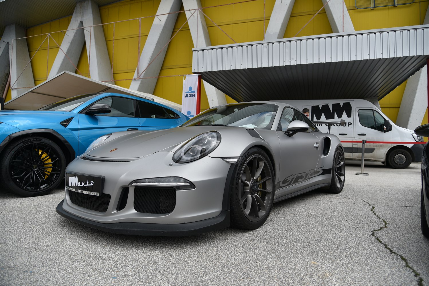 Front side view of Porsche 911 GT3 RS with aerodynamic features and alloy wheels