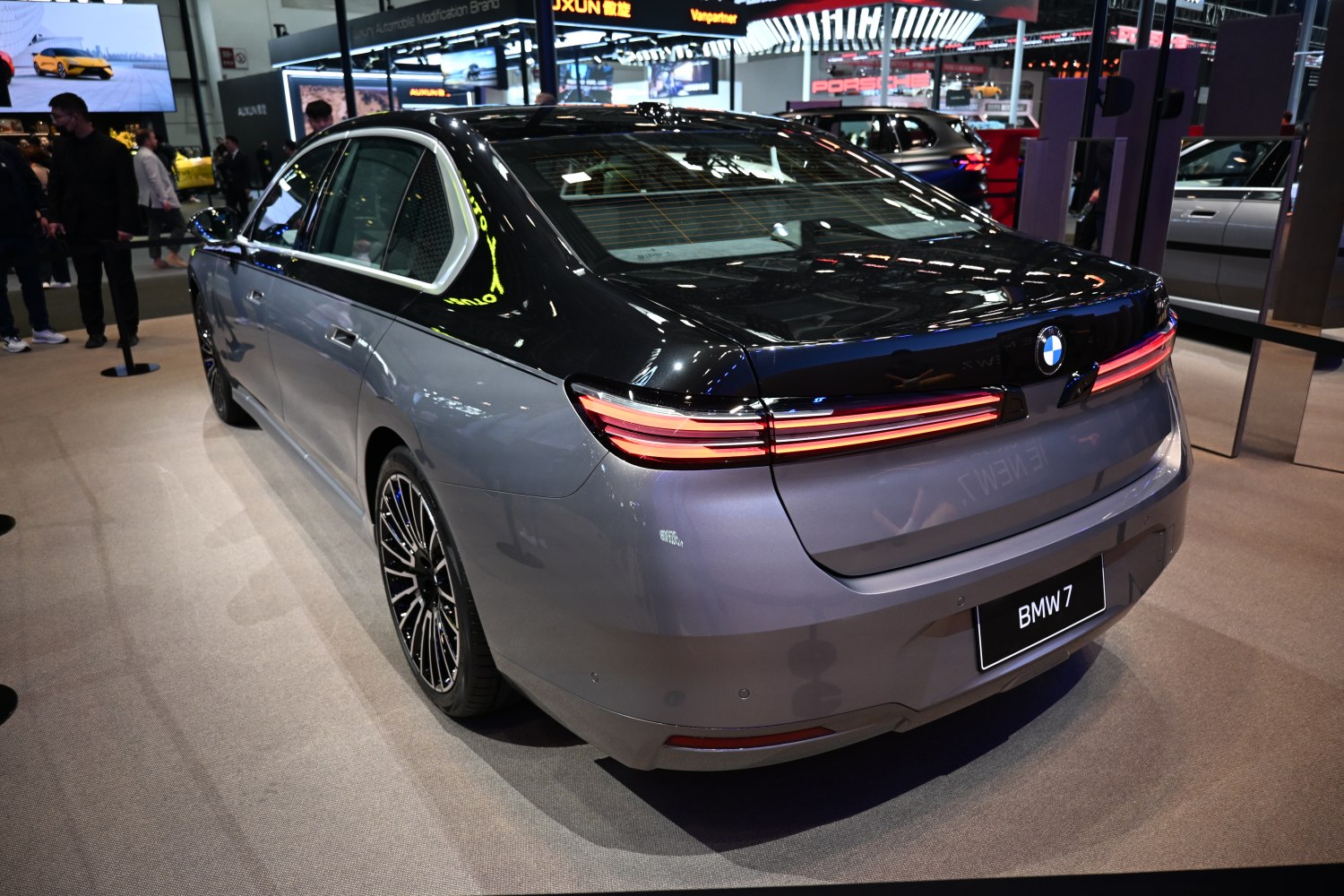 Luxury sedan rear design with sleek taillights and alloy wheels