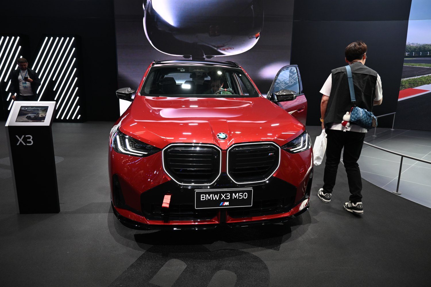 Front grille and LED headlights of a red SUV