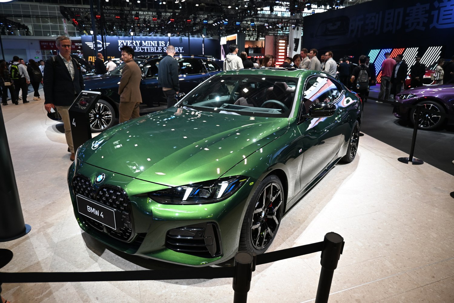 Sporty coupe front view with aggressive grille and black alloy wheels