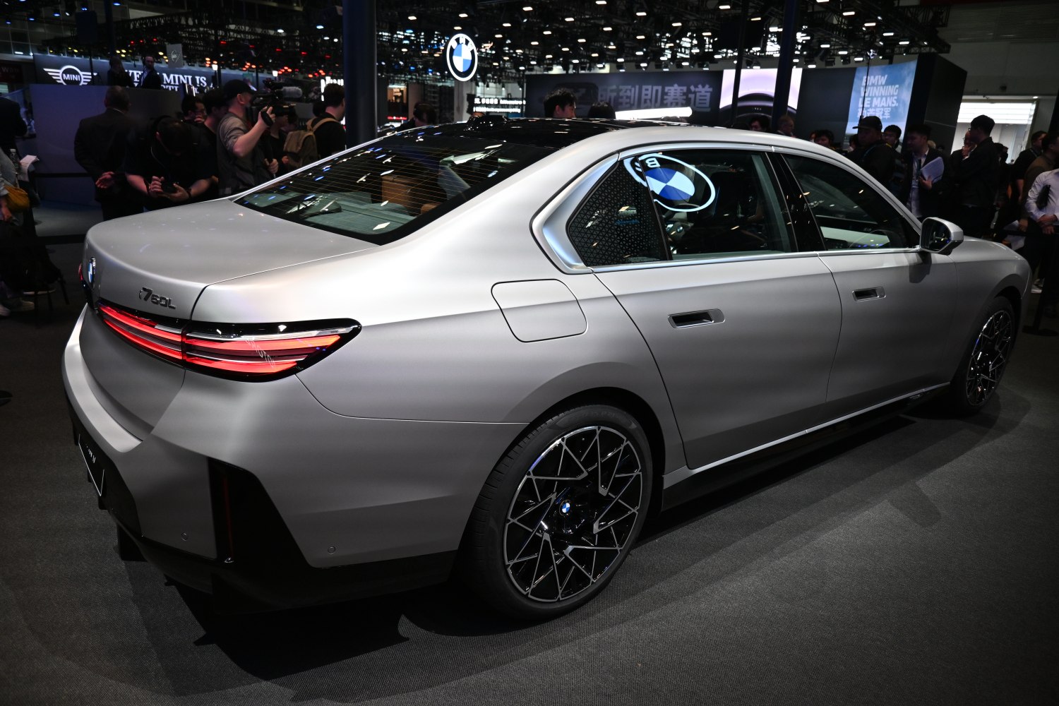 Sleek luxury sedan rear with LED taillights and detailed alloy wheels