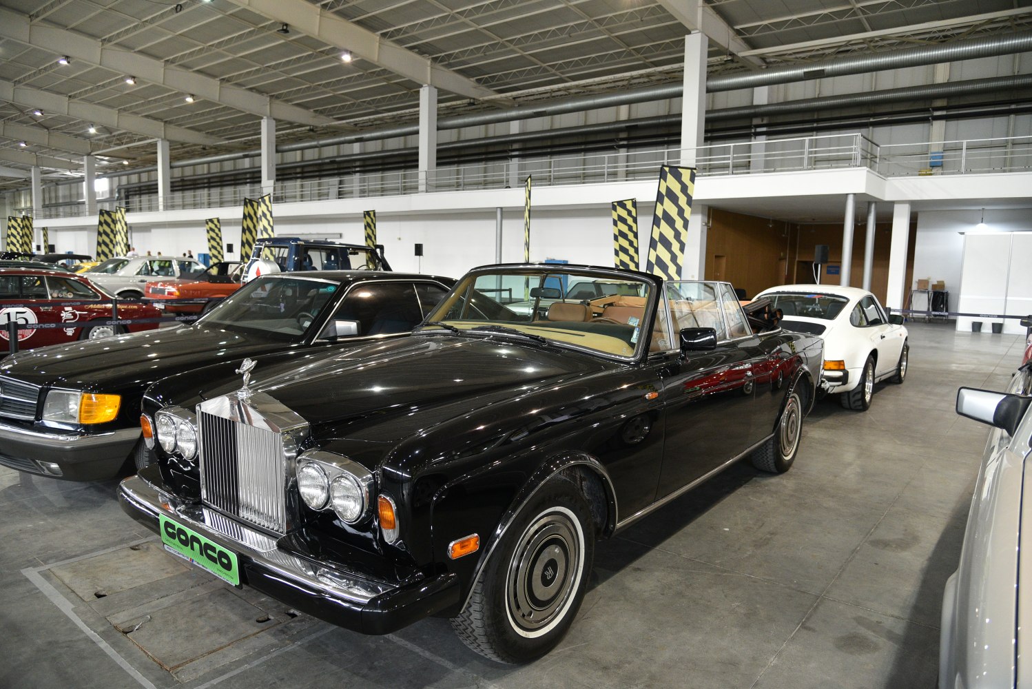 Classic luxury convertible with iconic grille and dual headlights.