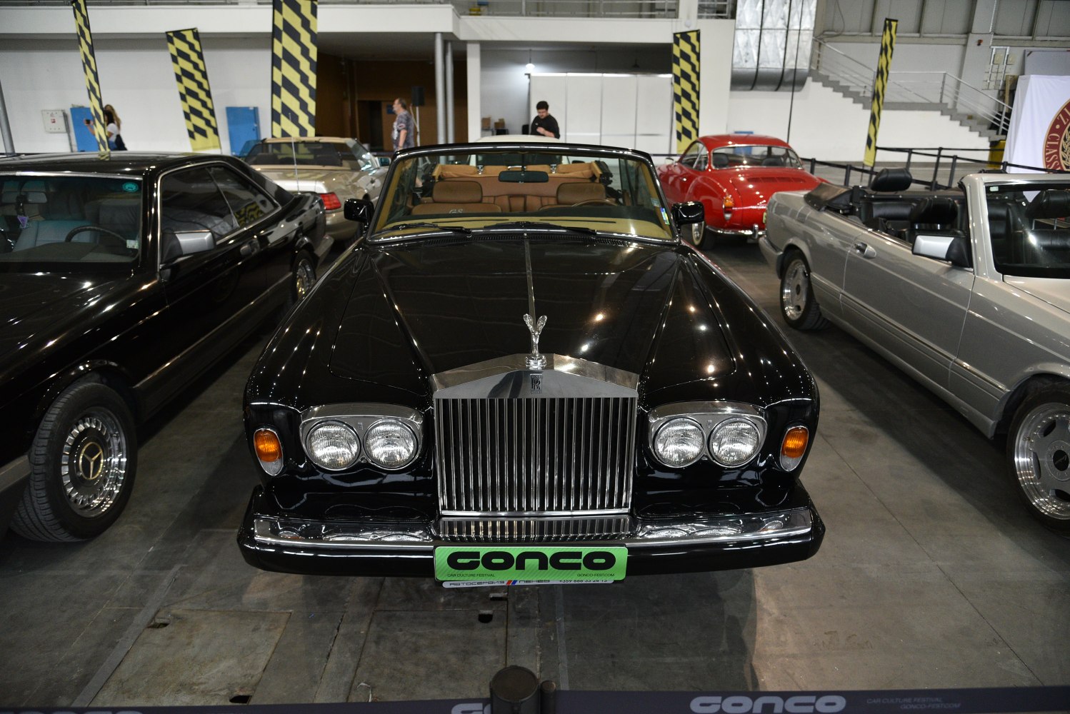 Front view of classic convertible with iconic grille and dual round headlights.