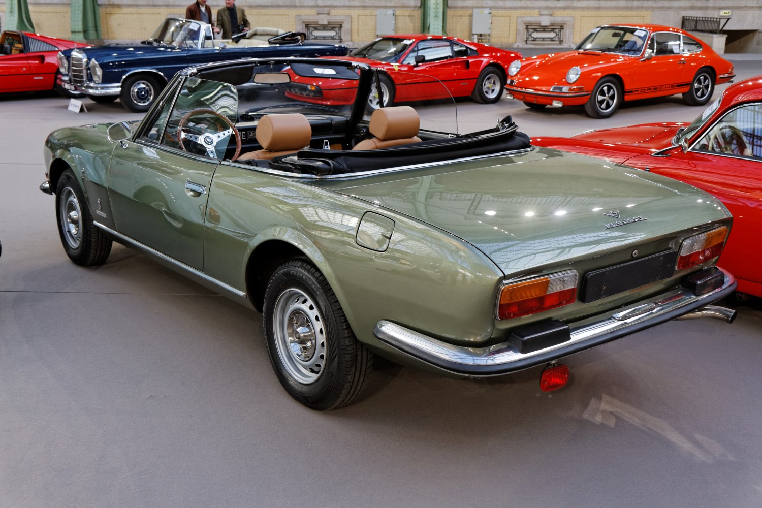 Rear view of classic convertible with tan interior and open top