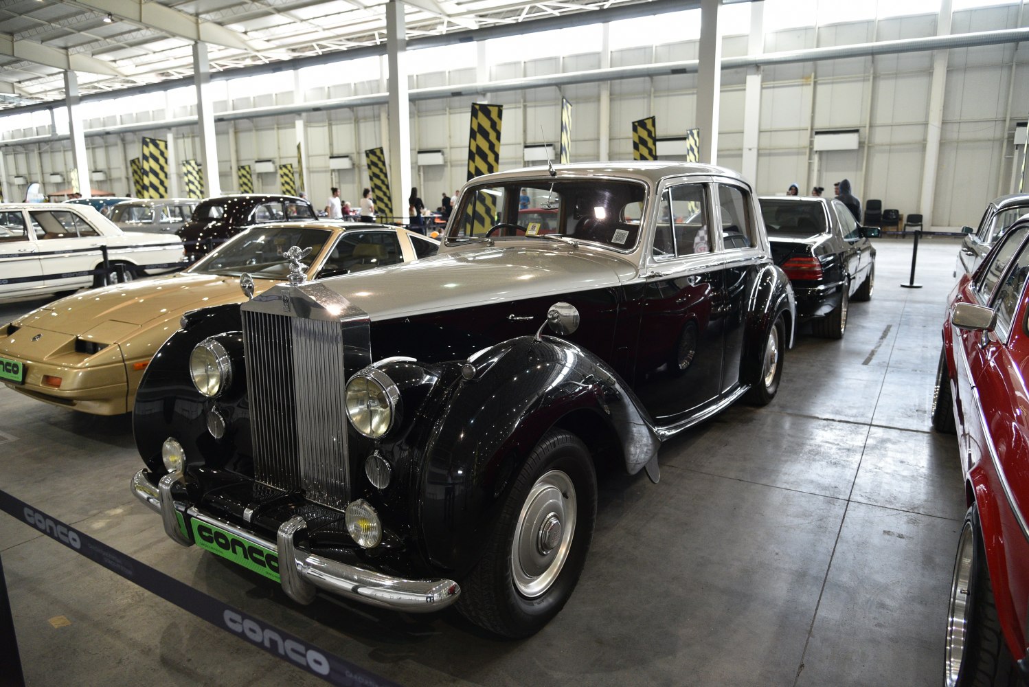 Vintage luxury car with prominent front grille and round headlights