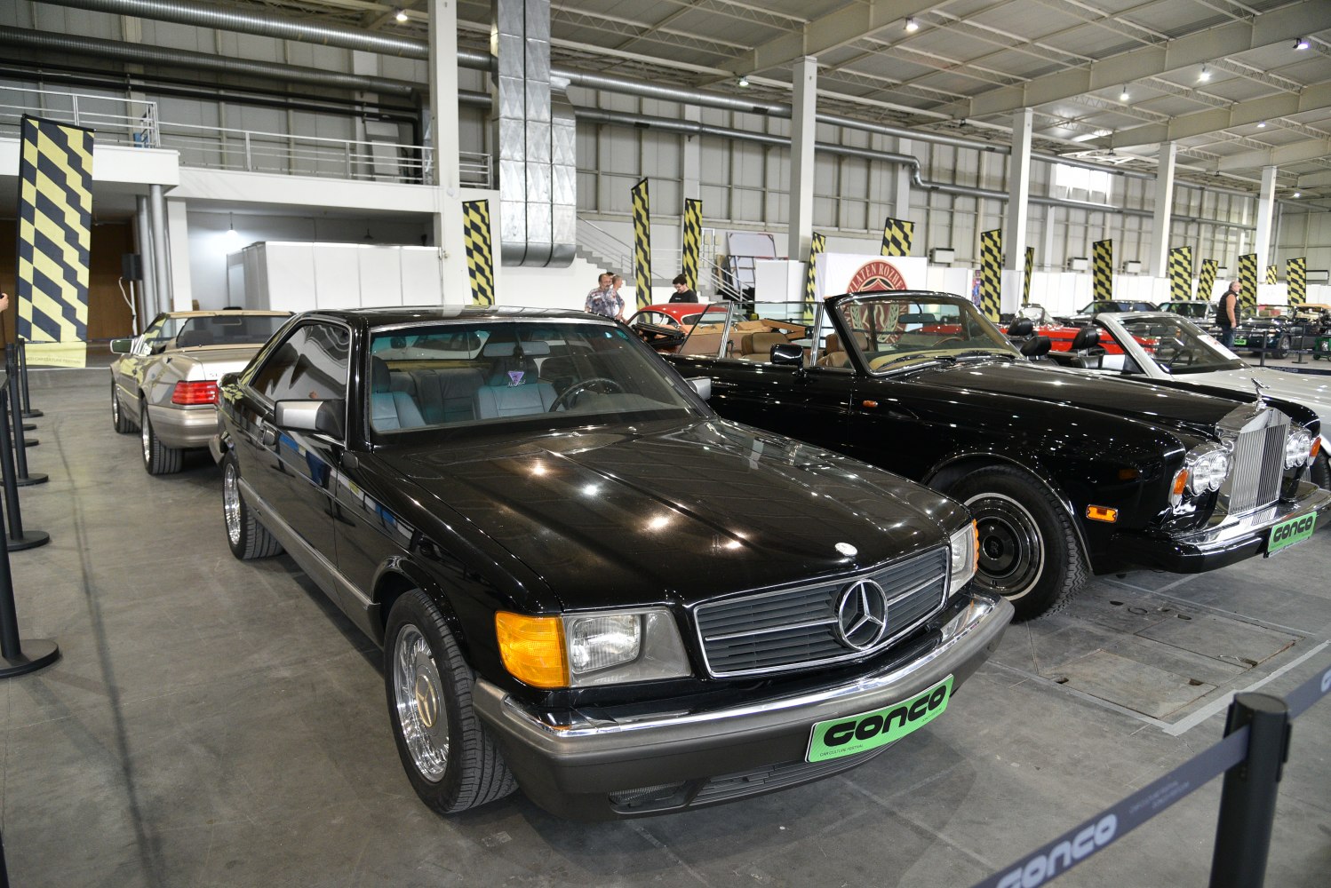 Front-side view of a classic coupe with grille and chrome details
