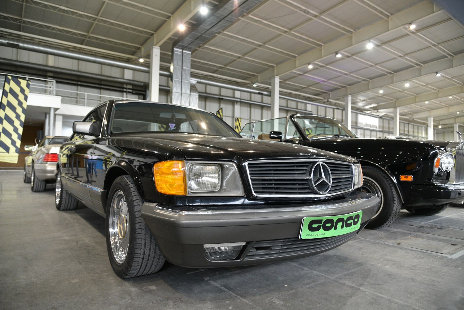 Front view with rectangular headlights and chrome-trimmed grille