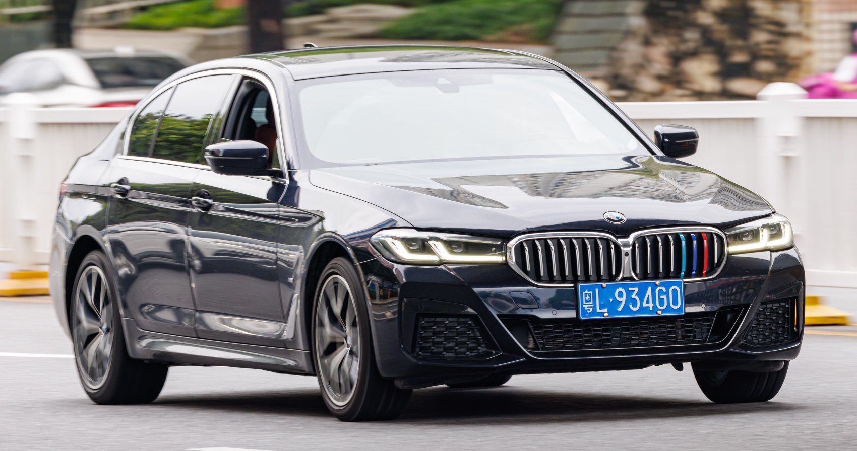 Front view with distinctive grille and headlights of a luxury sedan