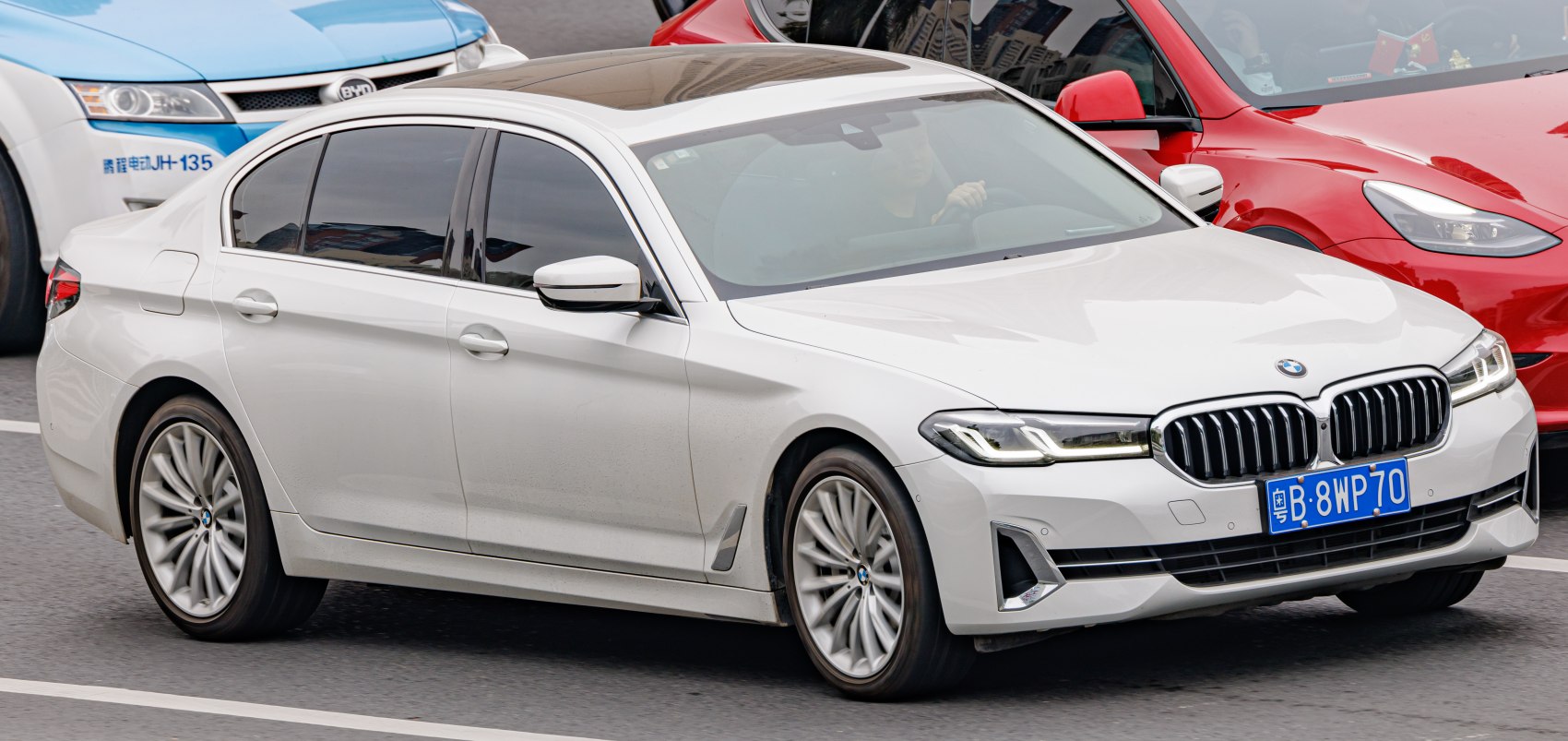 White luxury sedan with kidney grille and LED headlights