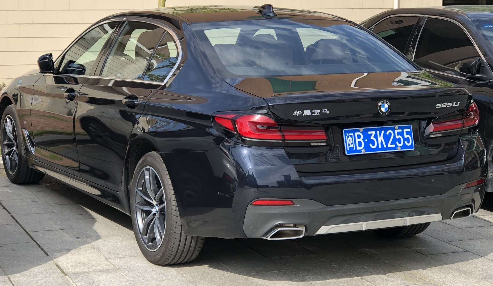 Rear and side view with tail lights and dual exhaust tips