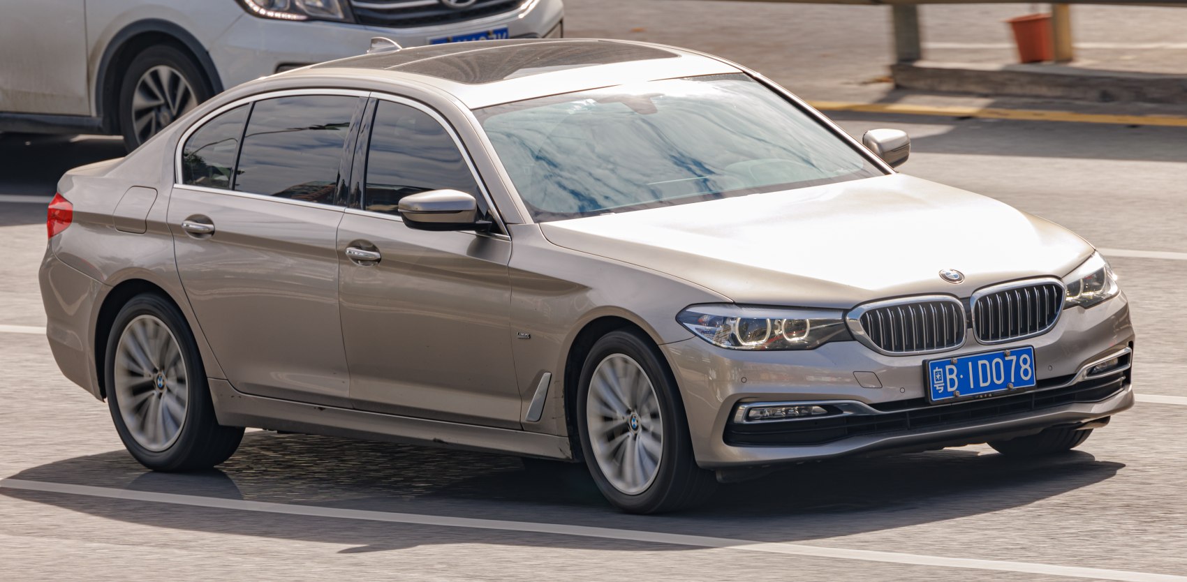 Front side view with headlights and grille of luxury sedan