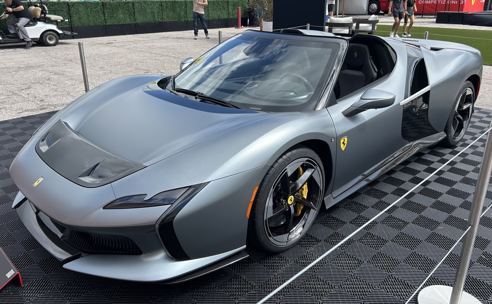 Aerodynamic convertible with black alloy wheels and yellow brake calipers