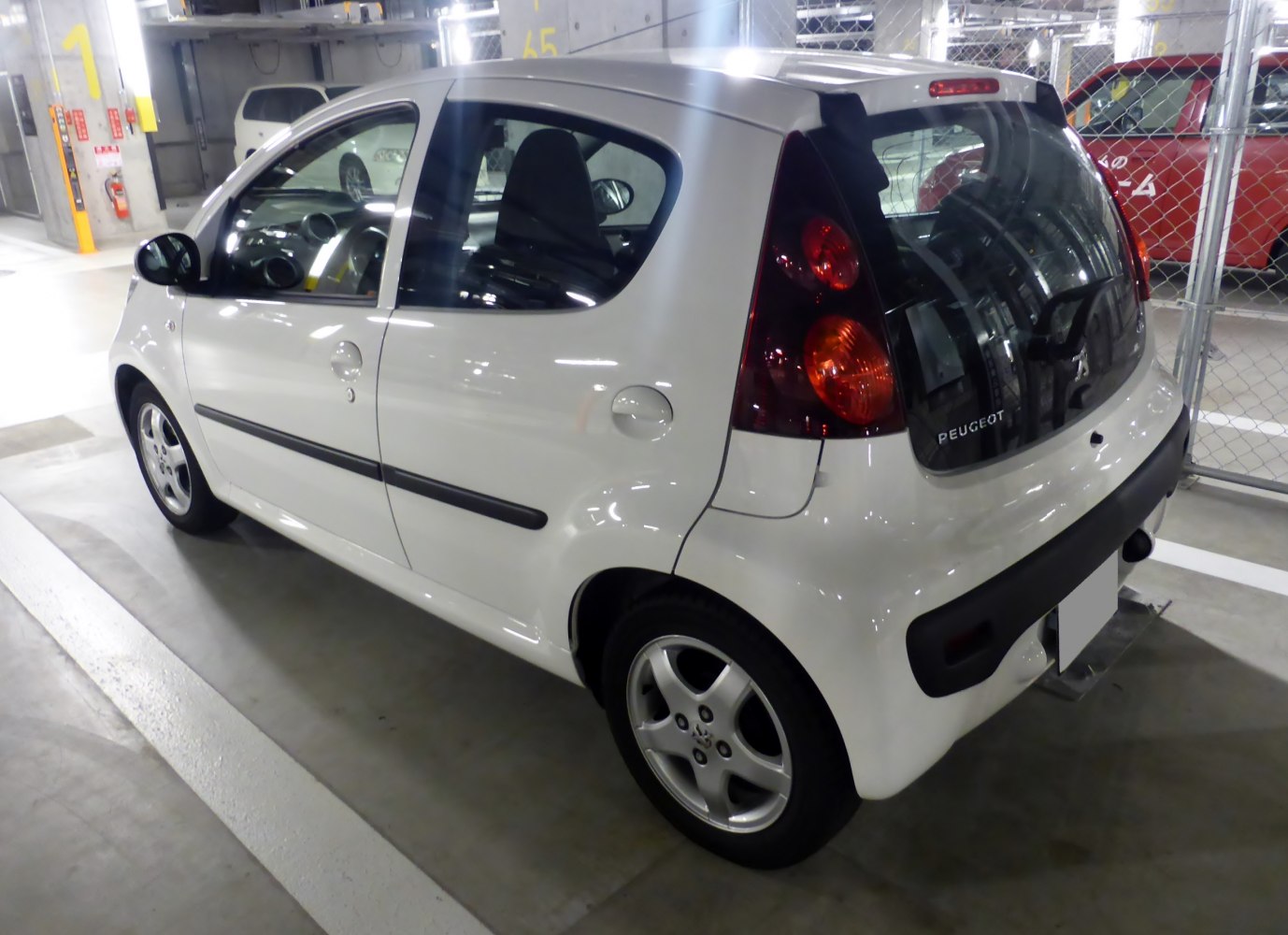 Compact 5-door hatchback rear profile with distinctive taillights