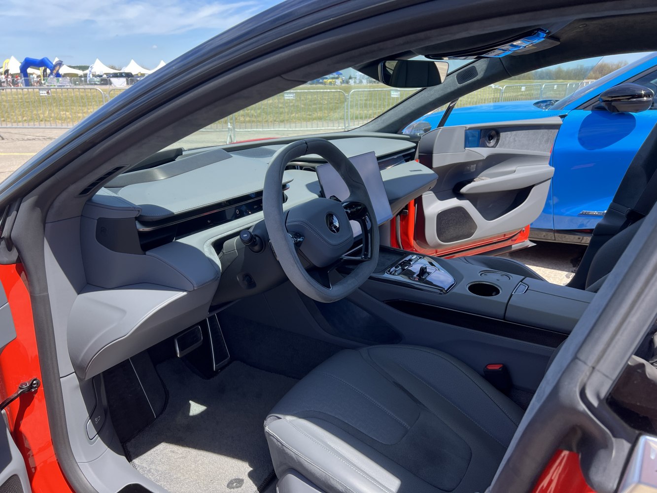 Modern digital dashboard and steering wheel in sleek luxury car interior