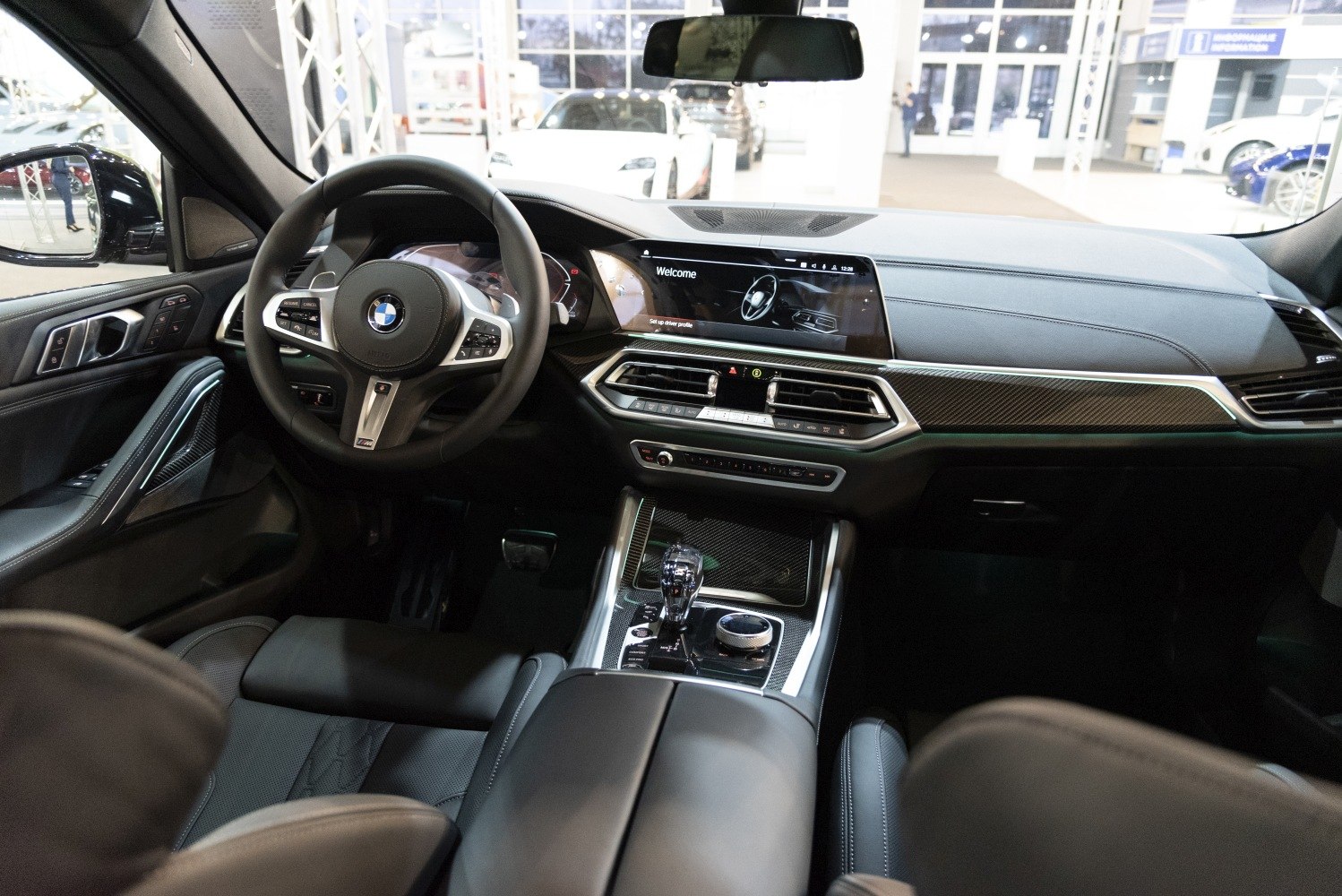 Luxury car interior with digital dashboard and multifunction steering wheel