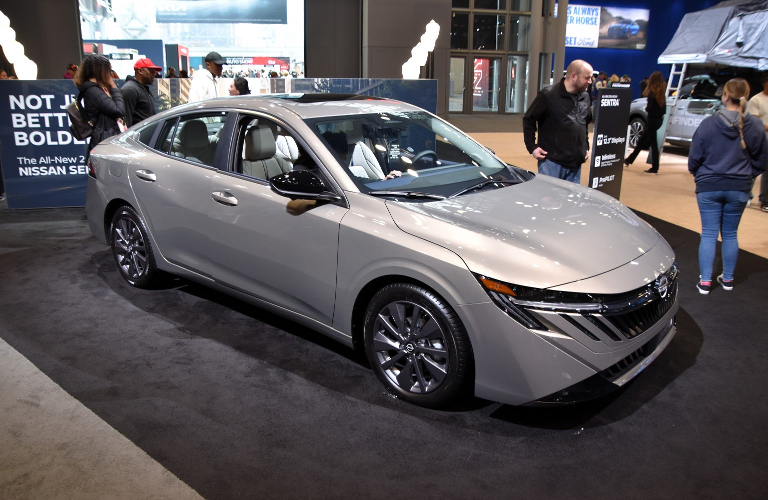 Sleek front fascia and aerodynamic side profile of a modern sedan