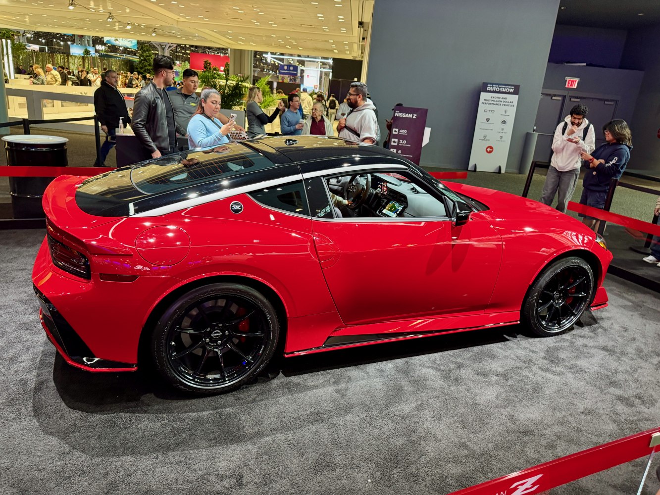 Sleek side view of sporty coupe with black roof and wheels