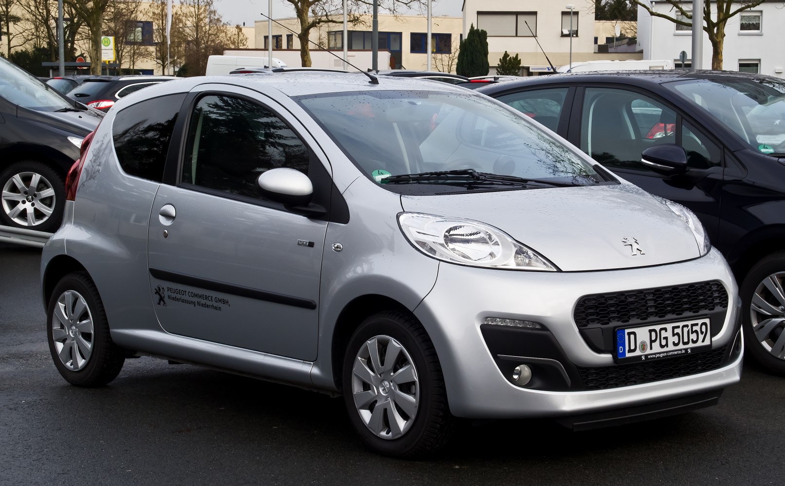 Compact 3-door hatchback with aerodynamic front and unique headlights