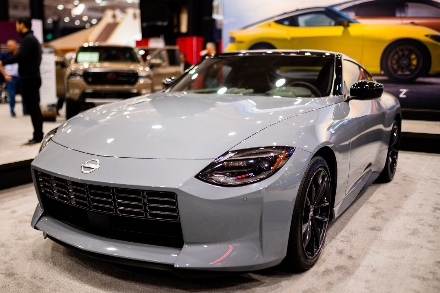 Sleek front grille and sharp headlights of a sports coupe