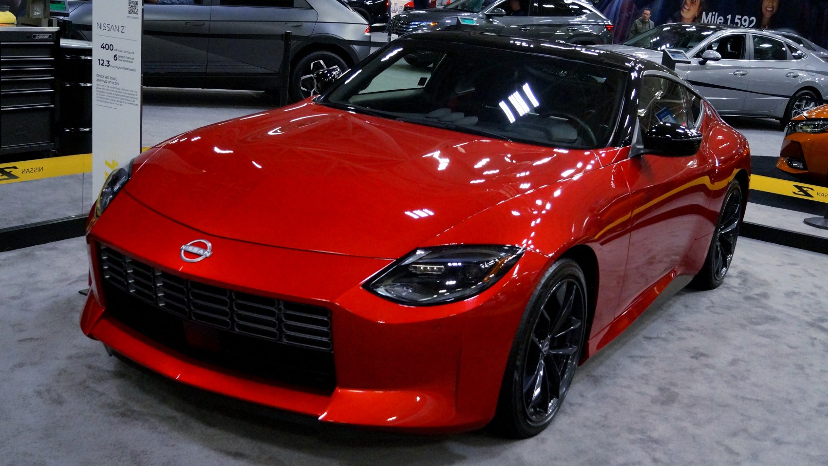 Front close-up of Nissan Z with sharp headlights and red body