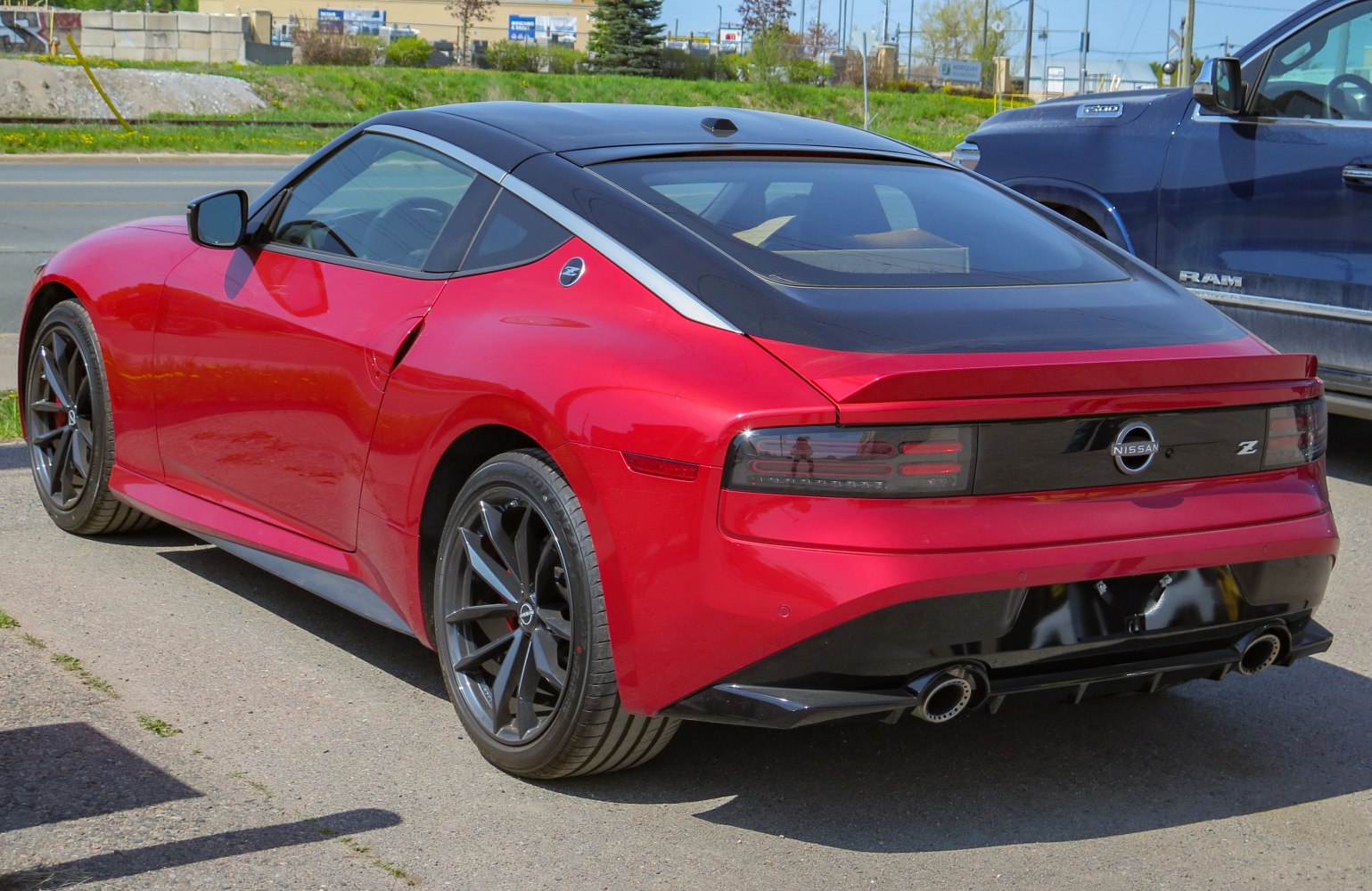 Sporty rear and side view with sleek taillights and dual exhausts