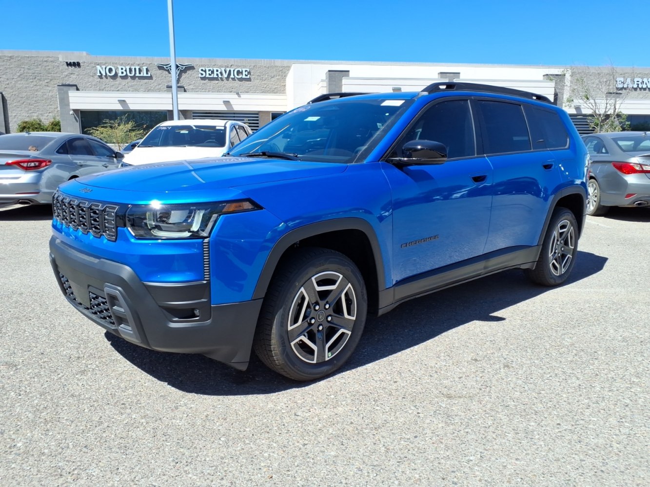 Blue SUV with LED headlights, black accents, and alloy wheels