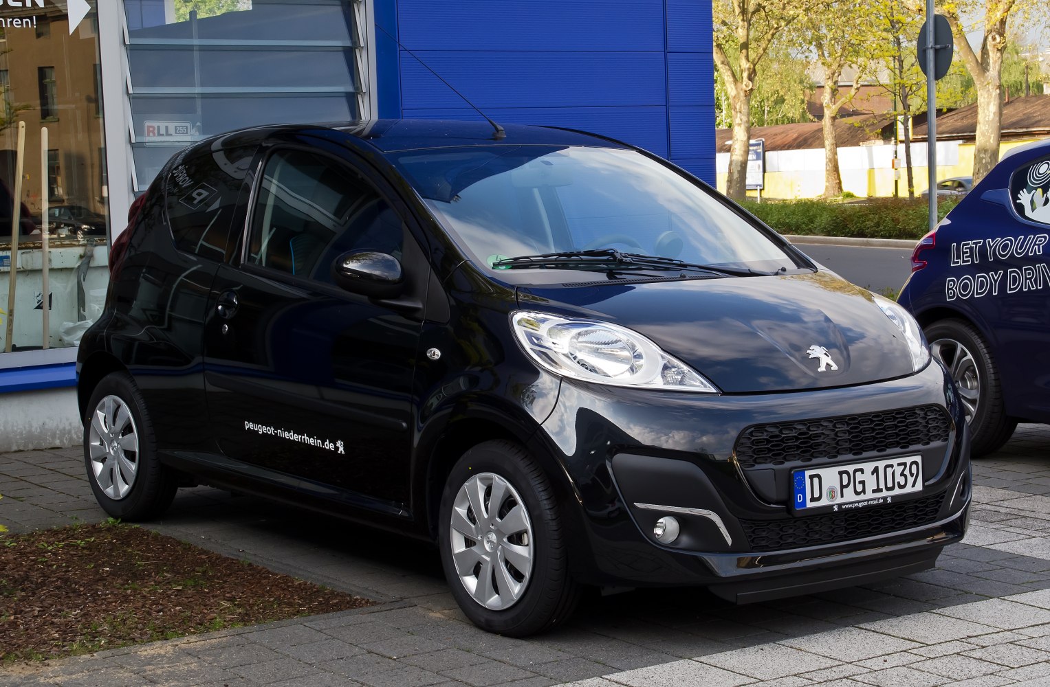 Compact black 3-door city car with modern design
