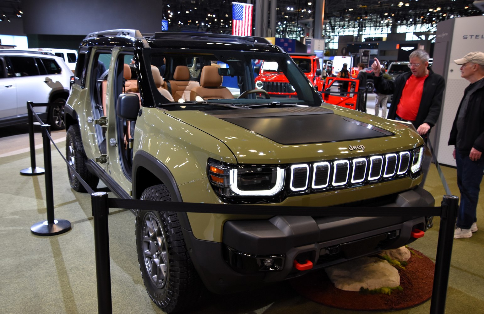 Front view of SUV with LED headlights and open side doors