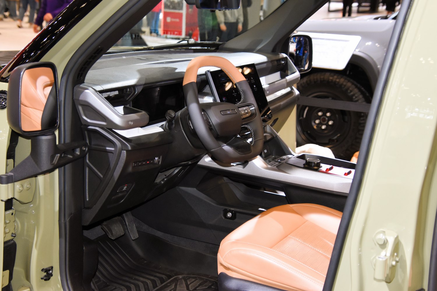 Modern dashboard with touchscreen and tan leather seats