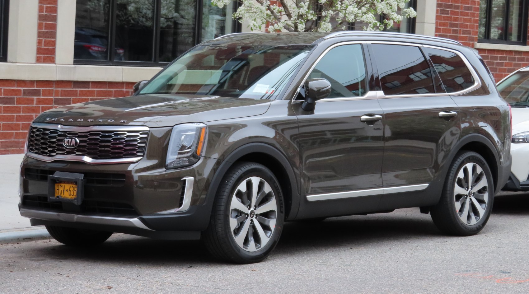 SUV with honeycomb front grille and vertical LED headlights