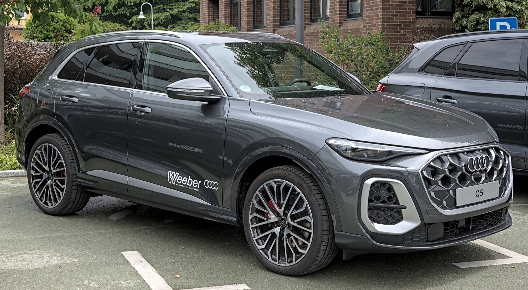 Bold front grille and sporty alloy wheels of a modern SUV
