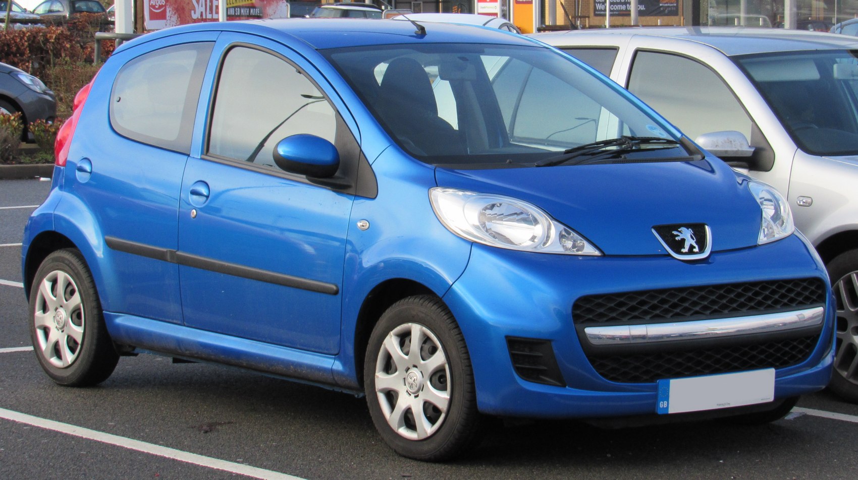 Blue compact 5-door hatchback with rounded headlights and wide grille
