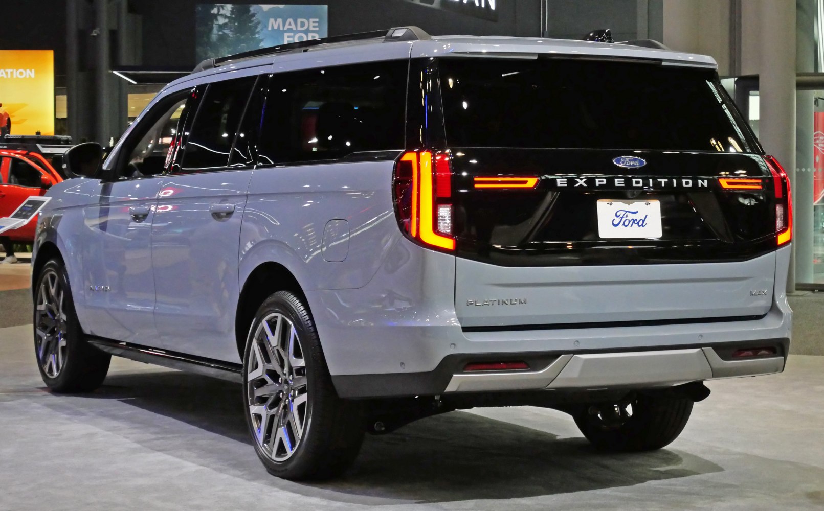 Full-size SUV rear with sleek LED taillights and black trim panel