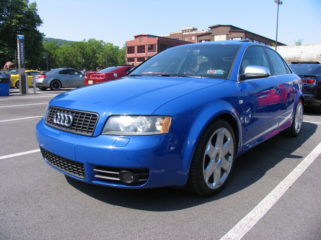 Blue sedan with front grille and alloy wheels