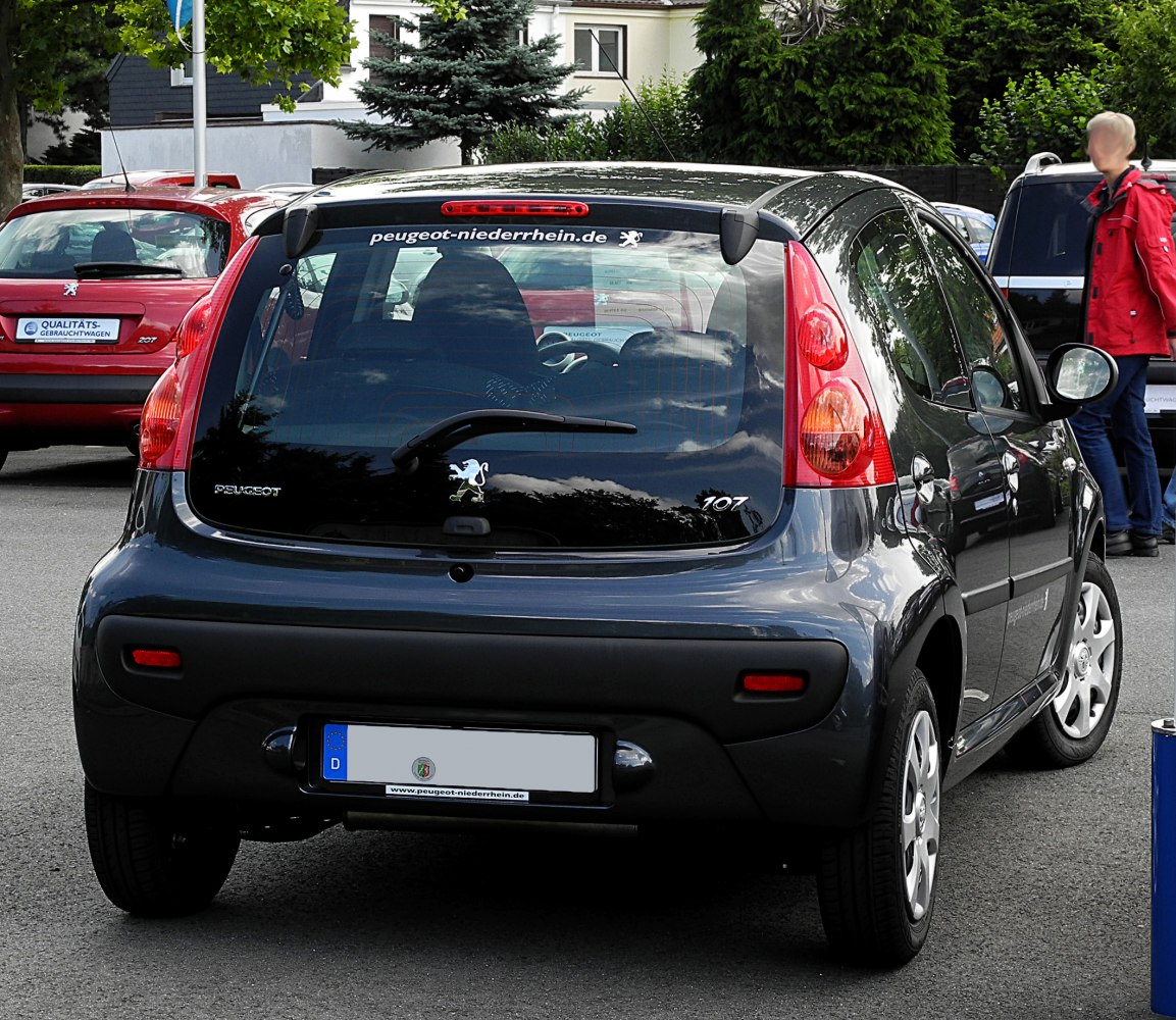 Compact hatchback rear with distinct taillights and rear window wiper