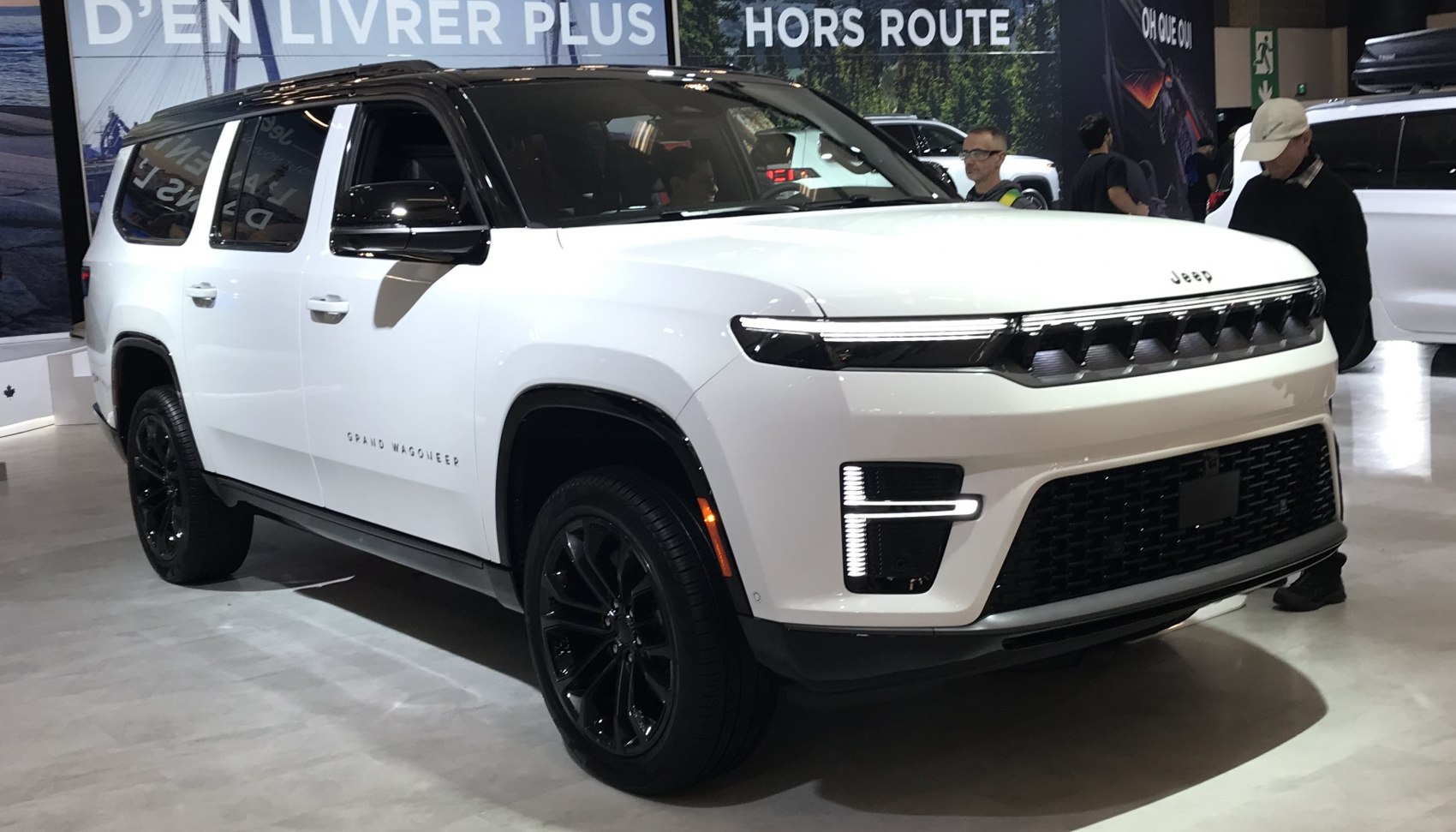 Luxury SUV front view with bold grille and LED lights