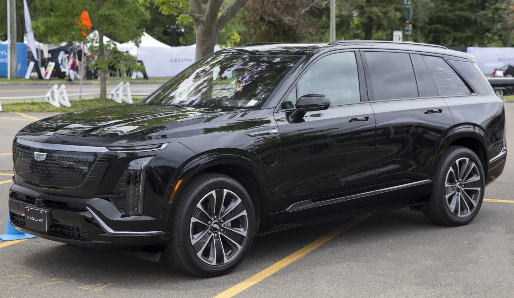 Black electric luxury SUV with LED headlights and aerodynamic wheels