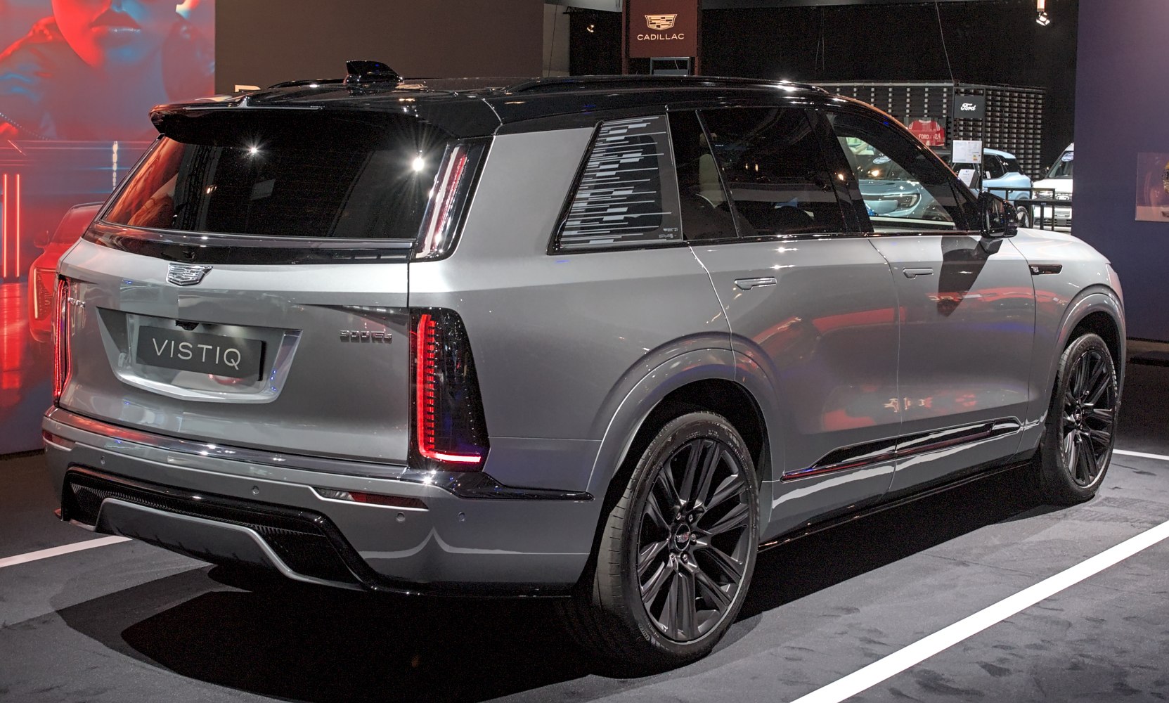 Rear and side profile of luxury SUV with sleek tail lights and black wheels