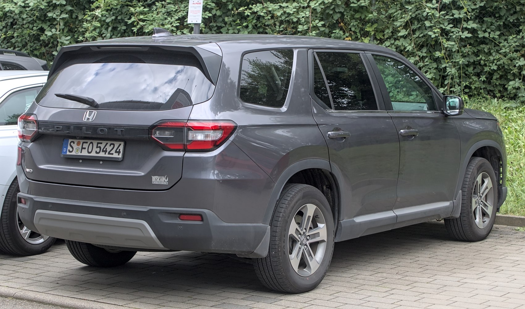 Rear and side view of an SUV with Beskar Edition badge and AWD emblem