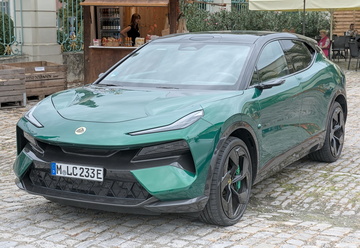 Front view of electric SUV with sharp headlights and aerodynamic body.