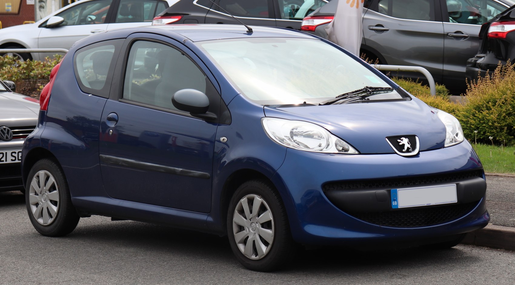 Compact 3-door hatchback with prominent front grille and headlights